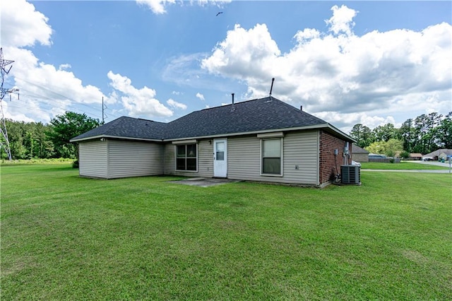 11257 Abbey Ln, Denham Springs, LA 70726 - rear view of property with a lawn, a shingled roof, and central air condition unit