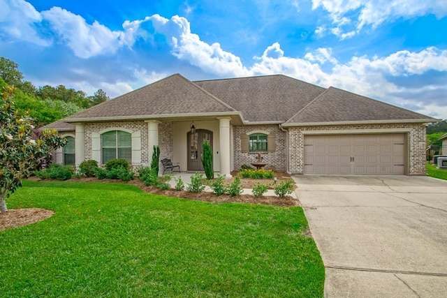 single story home featuring a front lawn, brick siding, a shingled roof, concrete driveway, and an attached garage