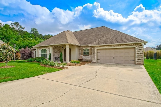 view of front of home with concrete driveway, brick siding, and a front yard