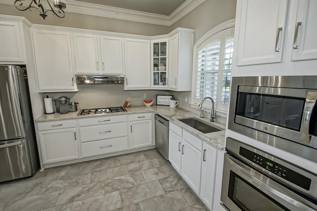 kitchen featuring a sink, white cabinetry, under cabinet range hood, and stainless steel appliances