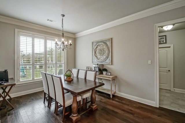 dining area with visible vents, baseboards, dark wood-style floors, a chandelier, and ornamental molding