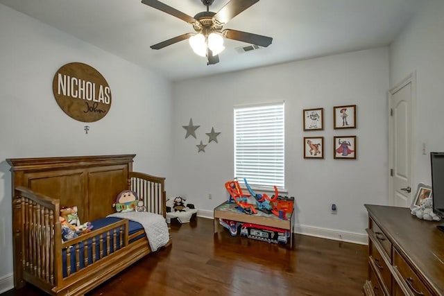 bedroom featuring baseboards, dark wood finished floors, and visible vents