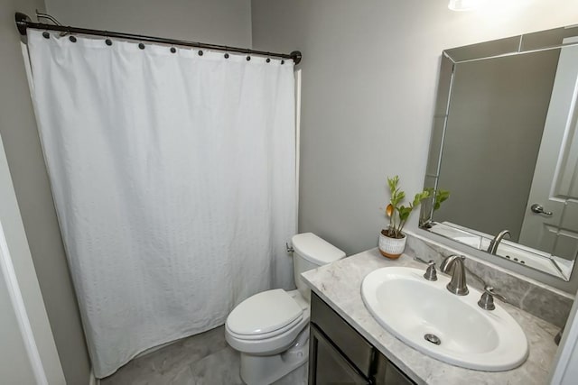 bathroom with vanity, a shower with curtain, and toilet