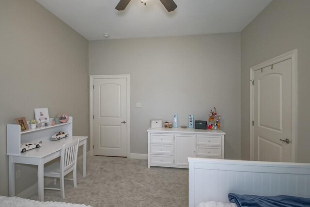 bedroom with baseboards, light carpet, and a ceiling fan