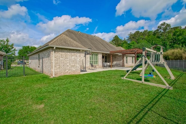 back of property with a patio area, brick siding, fence, a yard, and a pergola
