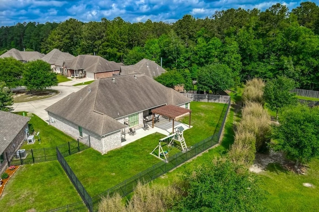 aerial view featuring a wooded view