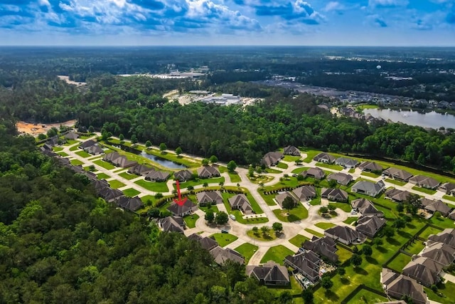 birds eye view of property with a residential view, a water view, and a forest view