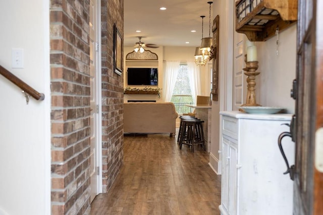 109COUSHATTACIRCLE Coushatta Cir, Madisonville, LA 70447 - hall featuring recessed lighting, wood finished floors, and brick wall