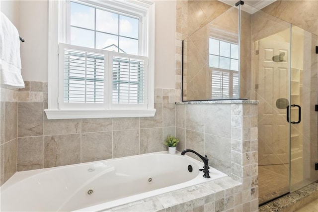 full bathroom with a jetted tub and a shower stall
