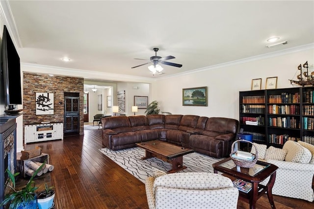 living area featuring visible vents, a ceiling fan, wood-type flooring, and ornamental molding