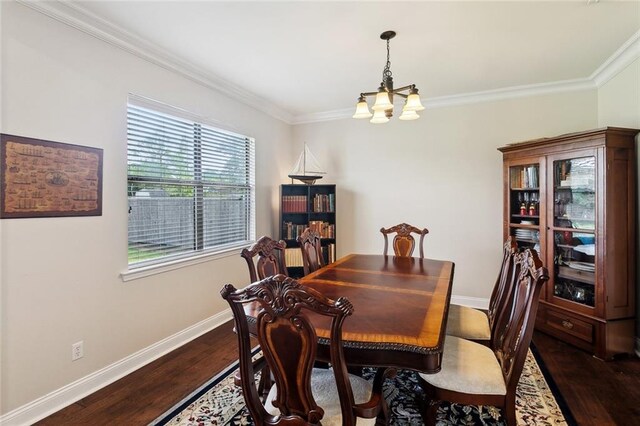 dining area with baseboards, a notable chandelier, ornamental molding, and dark wood finished floors