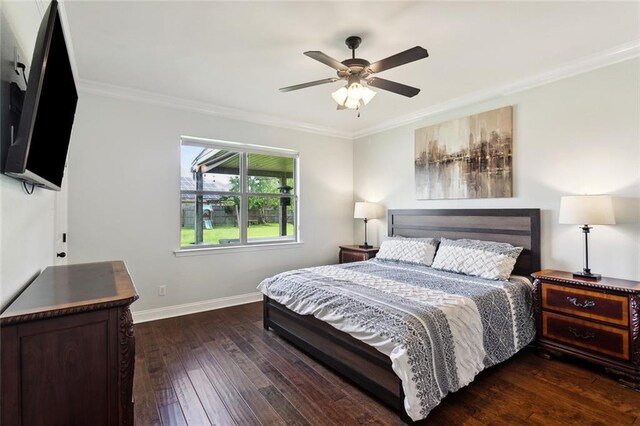 bedroom with crown molding, baseboards, ceiling fan, and dark wood finished floors