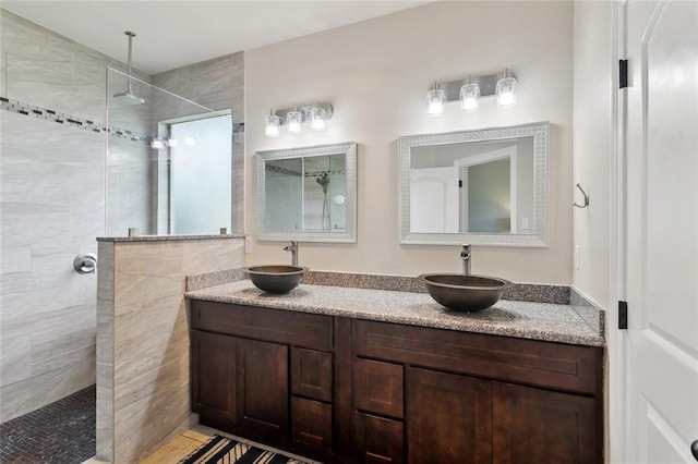 613 Del Sol Pass, Covington, LA 70433 - full bathroom featuring a walk in shower and double vanity