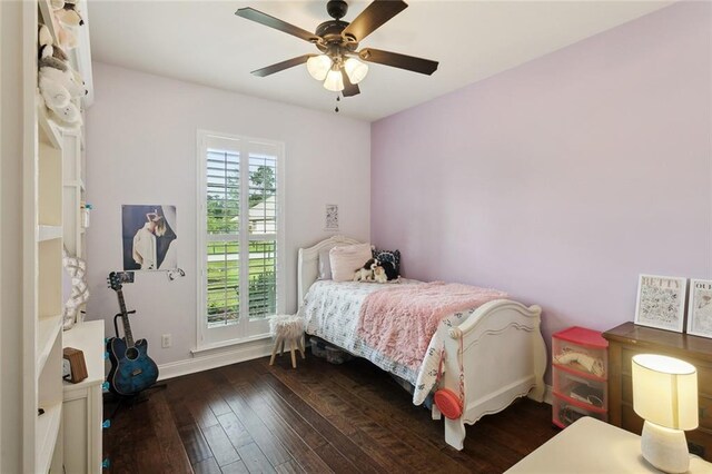 bedroom featuring baseboards, ceiling fan, and hardwood / wood-style flooring