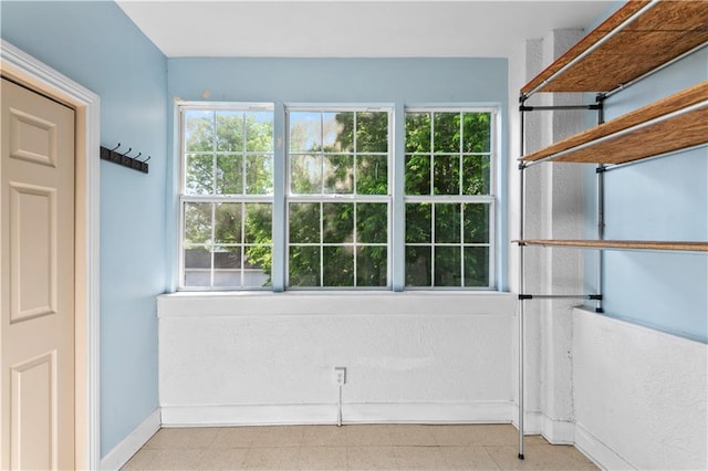 interior space with tile patterned floors