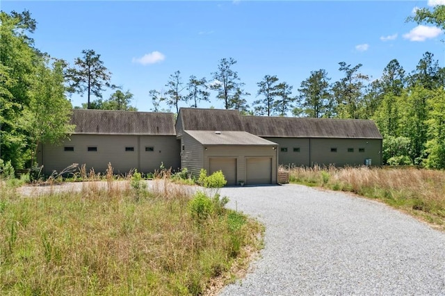 view of front of house with driveway and a garage