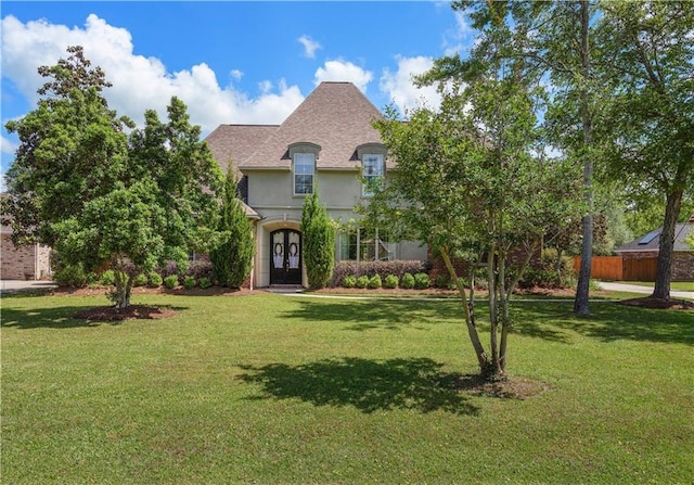 364 Winchester Cir, Mandeville, LA 70448 - french country home featuring french doors, stucco siding, and a front yard