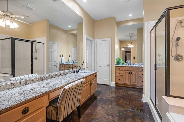 364 Winchester Cir, Mandeville, LA 70448 - bathroom featuring ceiling fan, visible vents, a stall shower, vanity, and recessed lighting