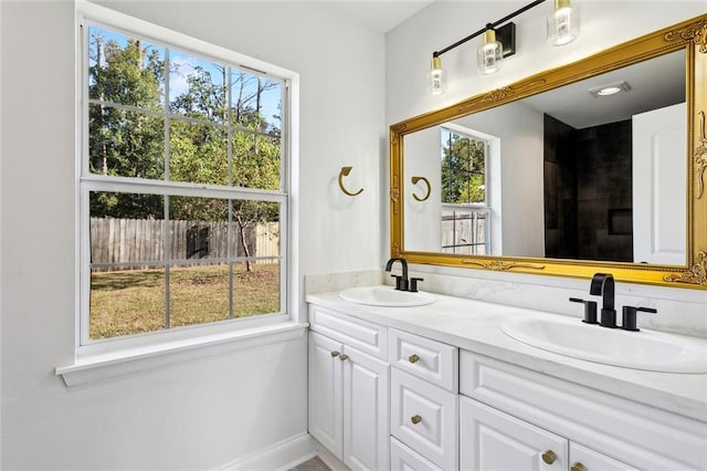 314 Raleigh Dr, Slidell, LA 70460 - bathroom featuring double vanity and plenty of natural light