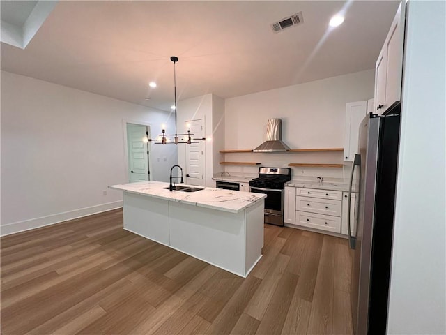 kitchen with open shelves, a sink, dark wood finished floors, stainless steel appliances, and visible vents