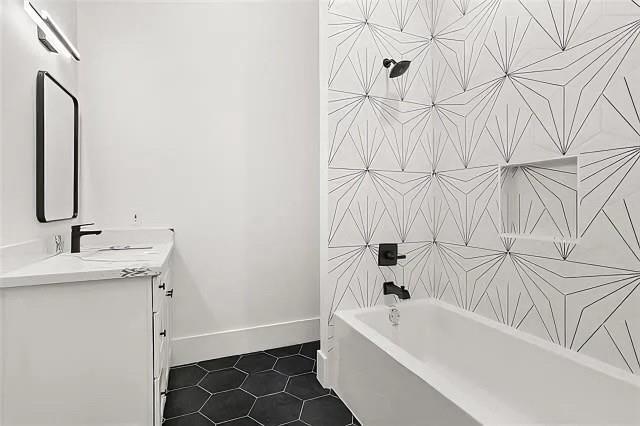 bathroom featuring shower / bath combination, vanity, and tile patterned floors