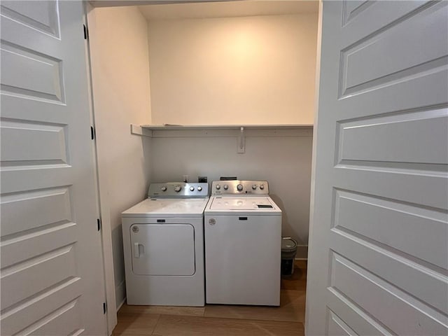 washroom featuring washer and dryer