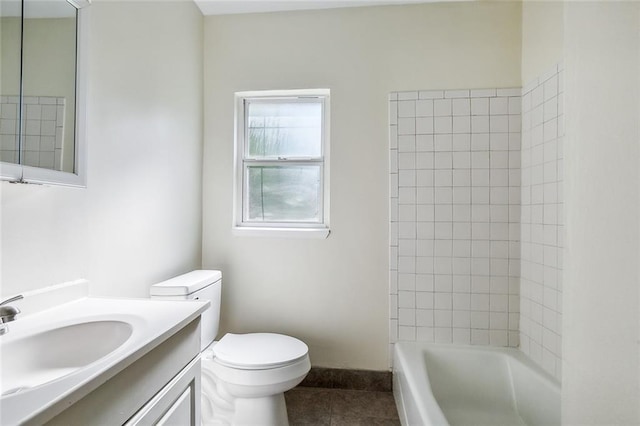full bath featuring vanity, tub / shower combination, toilet, baseboards, and tile patterned floors