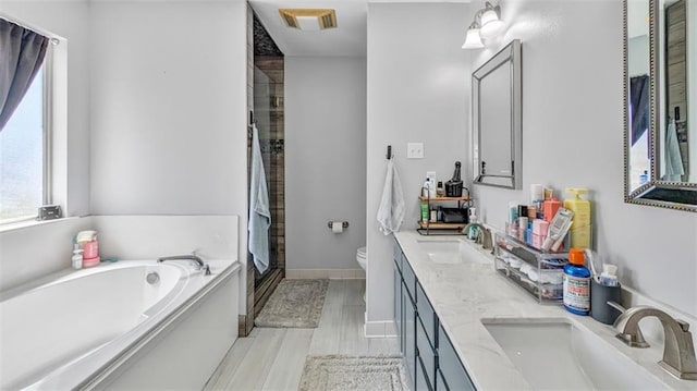 bathroom with visible vents, a sink, a bath, and a stall shower