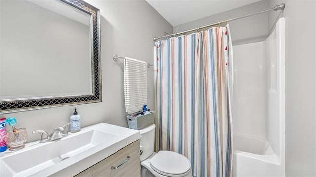 full bath with toilet, shower / bath combo, and vanity
