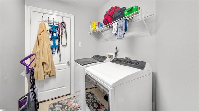 laundry area with laundry area and washer and clothes dryer