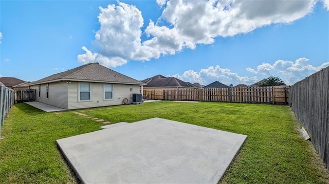 view of yard featuring central air condition unit, a fenced backyard, and a patio area