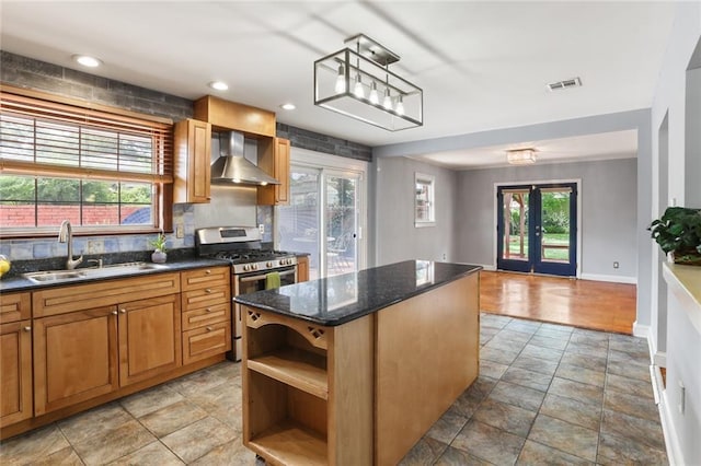 19 Rail St, New Orleans, LA 70124 - kitchen with wall chimney range hood, a sink, stainless steel gas range, open shelves, and french doors