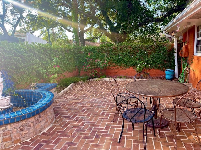 view of patio featuring outdoor dining area and a fenced backyard