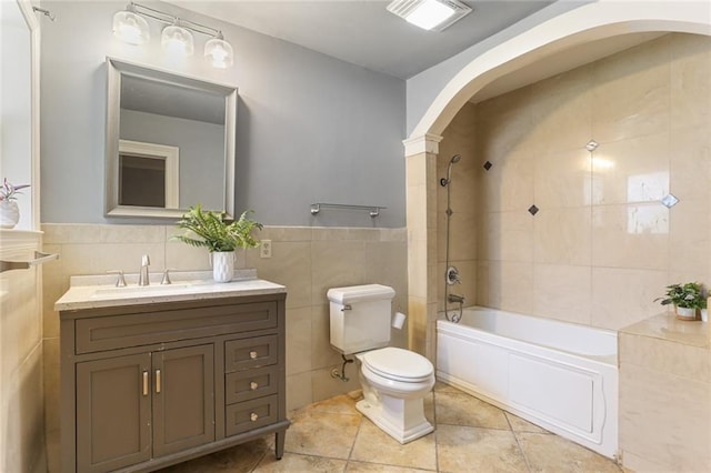 19 Rail St, New Orleans, LA 70124 - bathroom featuring tile walls, toilet, vanity, tile patterned floors, and  shower combination
