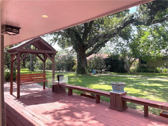 deck featuring a lawn and a gazebo