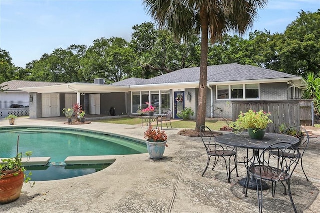 19 Rail St, New Orleans, LA 70124 - view of pool featuring a patio, a pool with connected hot tub, and an outdoor fire pit