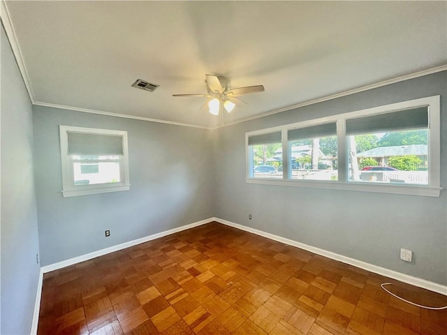 unfurnished room with a ceiling fan, baseboards, visible vents, and ornamental molding