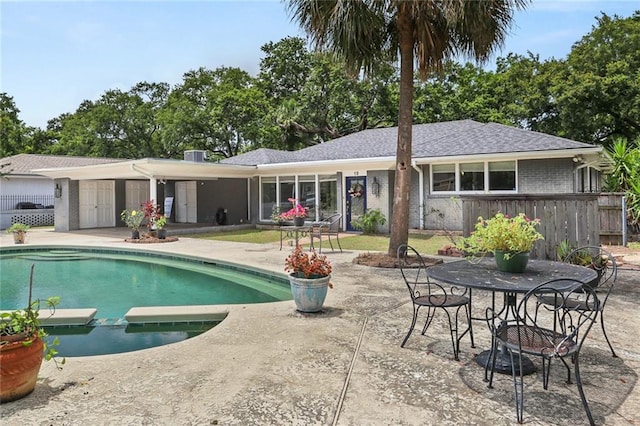 19 Rail St, New Orleans, LA 70124 - view of pool featuring a patio, an outdoor fire pit, and a pool with connected hot tub