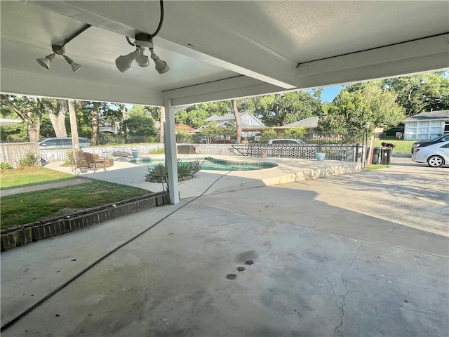 view of patio featuring ceiling fan, a fenced in pool, and a fenced backyard