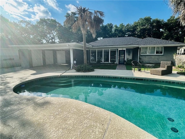 outdoor pool featuring a patio
