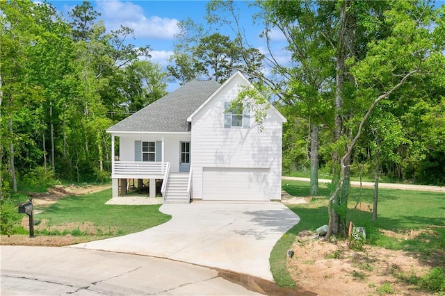 view of front facade with an attached garage, a shingled roof, stairway, a front yard, and concrete driveway