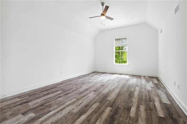 additional living space featuring ceiling fan, visible vents, baseboards, wood finished floors, and vaulted ceiling