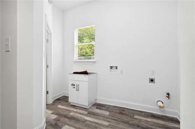 laundry area featuring hookup for an electric dryer, cabinet space, wood finished floors, baseboards, and hookup for a washing machine