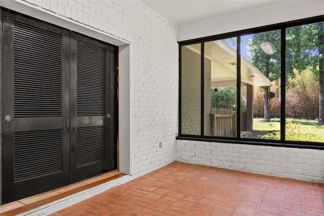 unfurnished sunroom with french doors