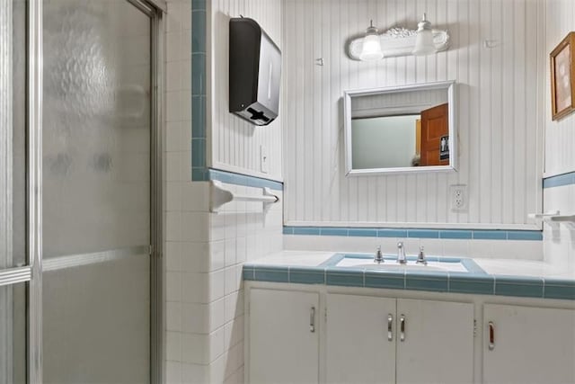 bathroom with vanity and a shower stall