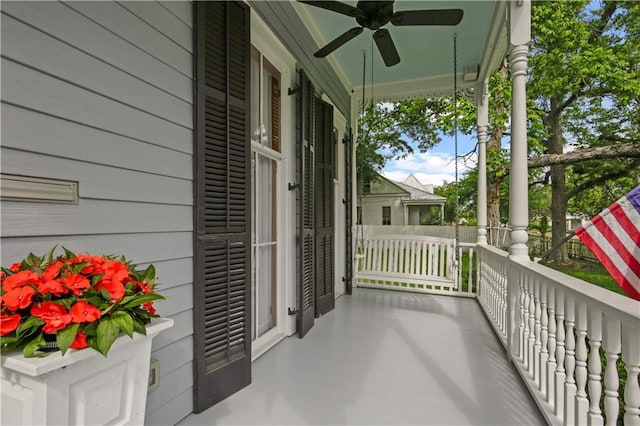 balcony featuring a ceiling fan and covered porch