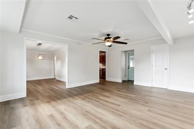 unfurnished living room featuring baseboards, visible vents, and light wood-type flooring