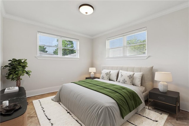 bedroom with baseboards, ornamental molding, and light tile patterned floors