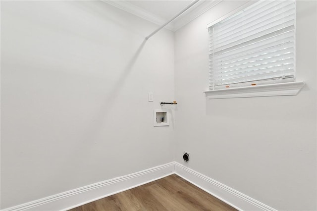 washroom with laundry area, hookup for a washing machine, baseboards, wood finished floors, and ornamental molding