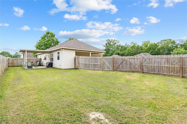 view of yard featuring a patio and a fenced backyard